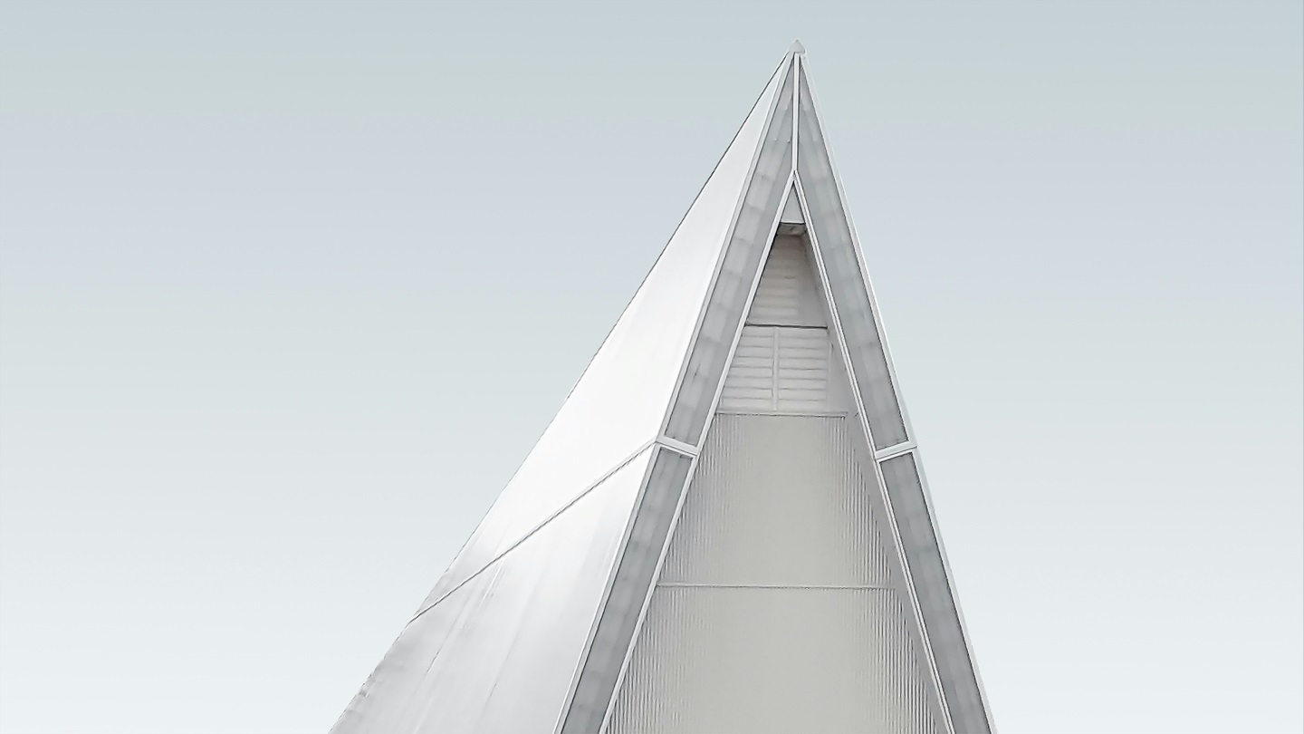 a triangular structure with a clear sky