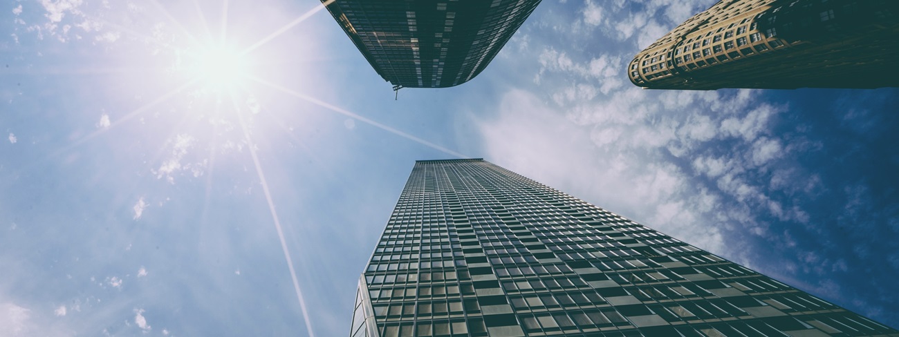 looking up view of tall buildings