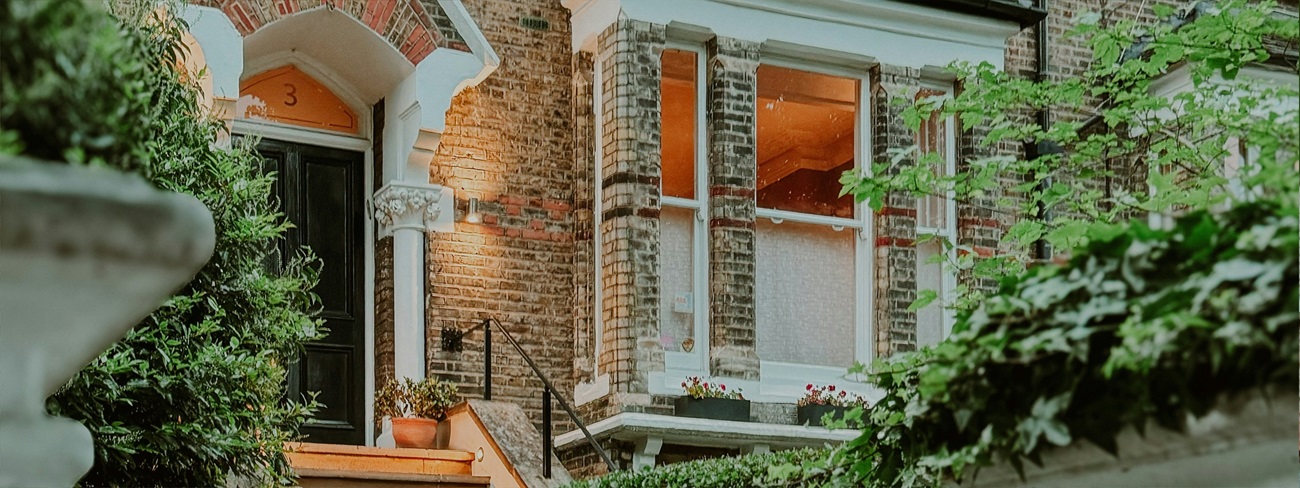 a house with stairs and a gate