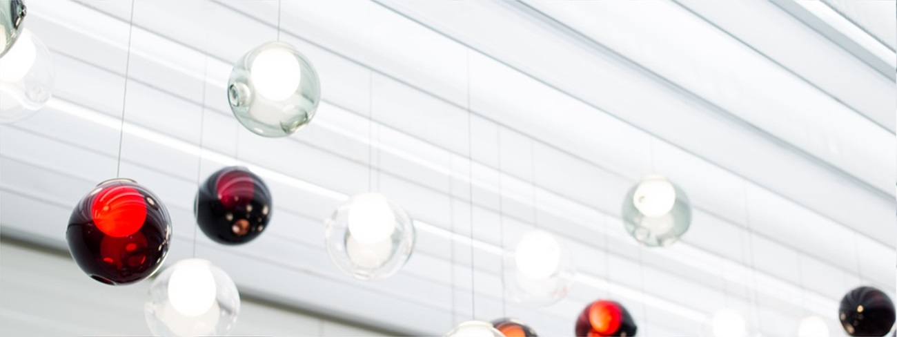 a group of glass balls from a ceiling