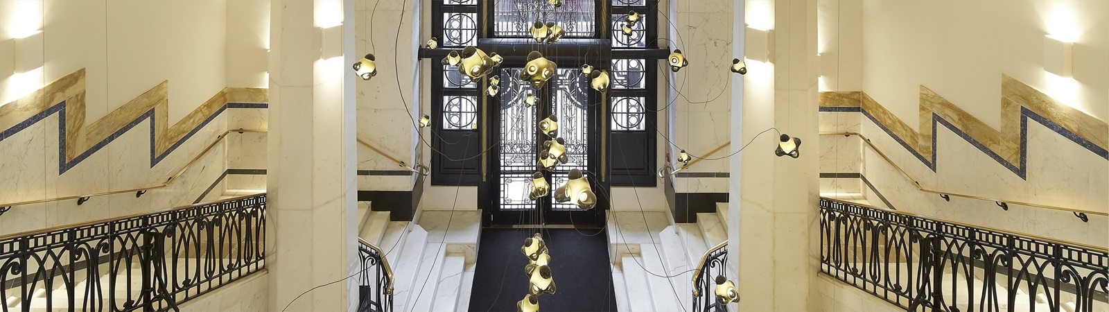 a hallway with a large window and stairs