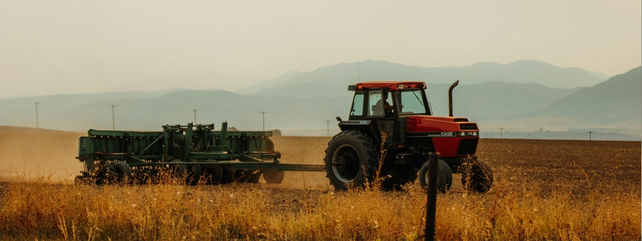 tractor harvesting field