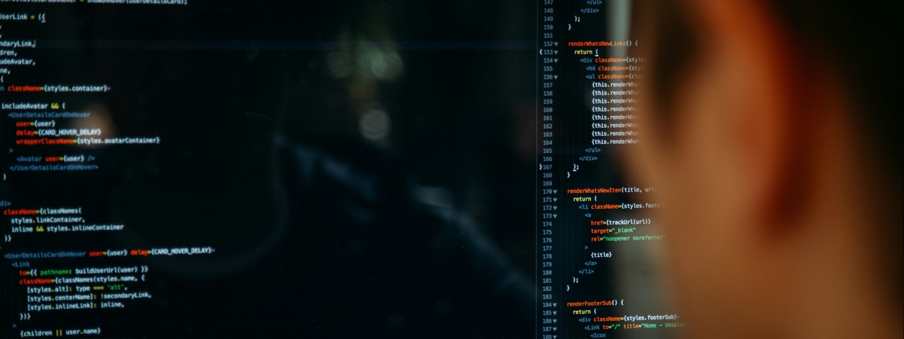 Person looking at screen of code