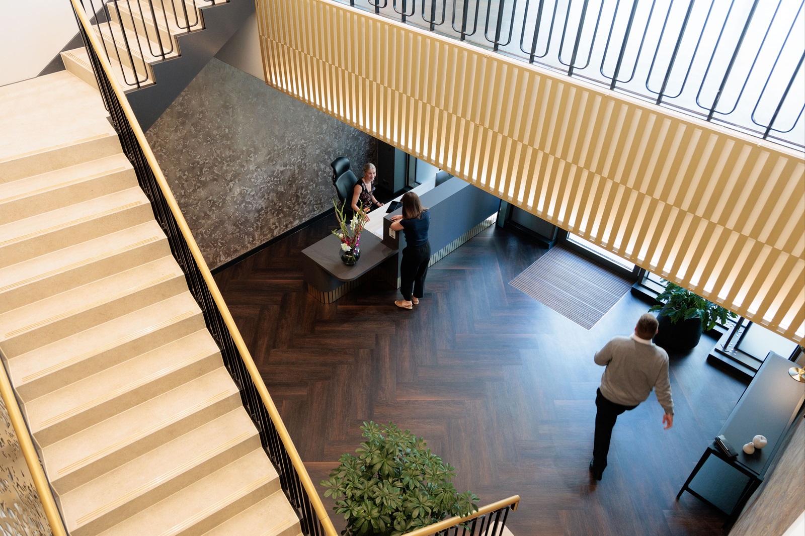 a group of people standing in a lobby