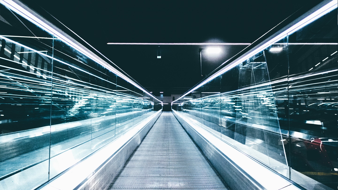 a high-tech walkway with lights on it